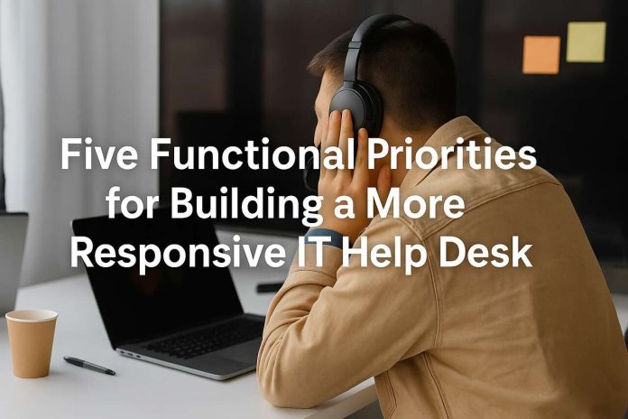 IT help desk agent working on laptop with headphones.
