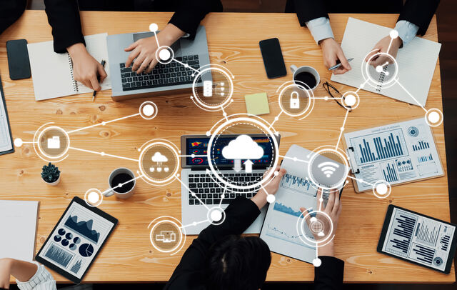 Team using cloud technology for traffic spike management.