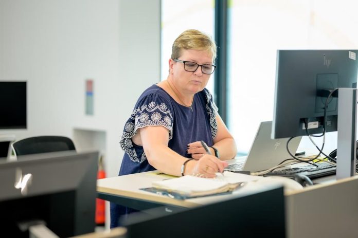 Businesswoman practicing advanced bookkeeping on computer