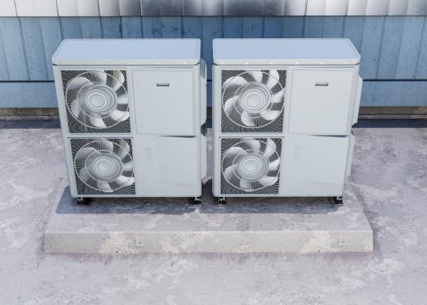 Two AC compressor units outside a building.