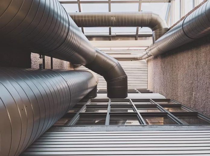 Modern HVAC ductwork in a sustainable commercial building.