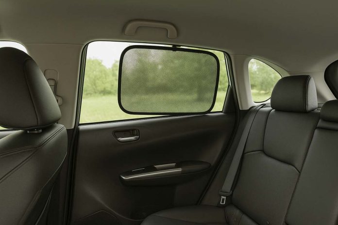 Rear window mesh sunshade installed inside a car.