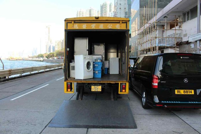Office moving truck with equipment during business relocation.