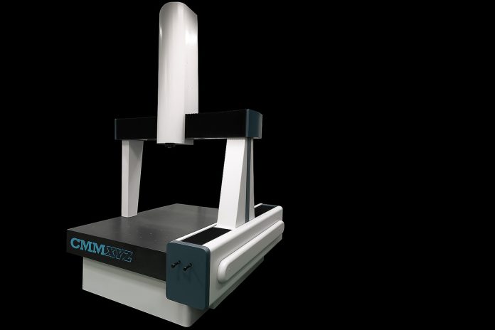 Landscape view of a CMM machine on a black background.