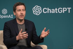 OpenAI executive discussing ChatGPT strategy at a tech event.