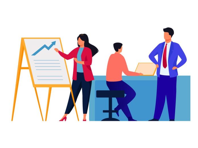 Team discussing a project poster with growth chart